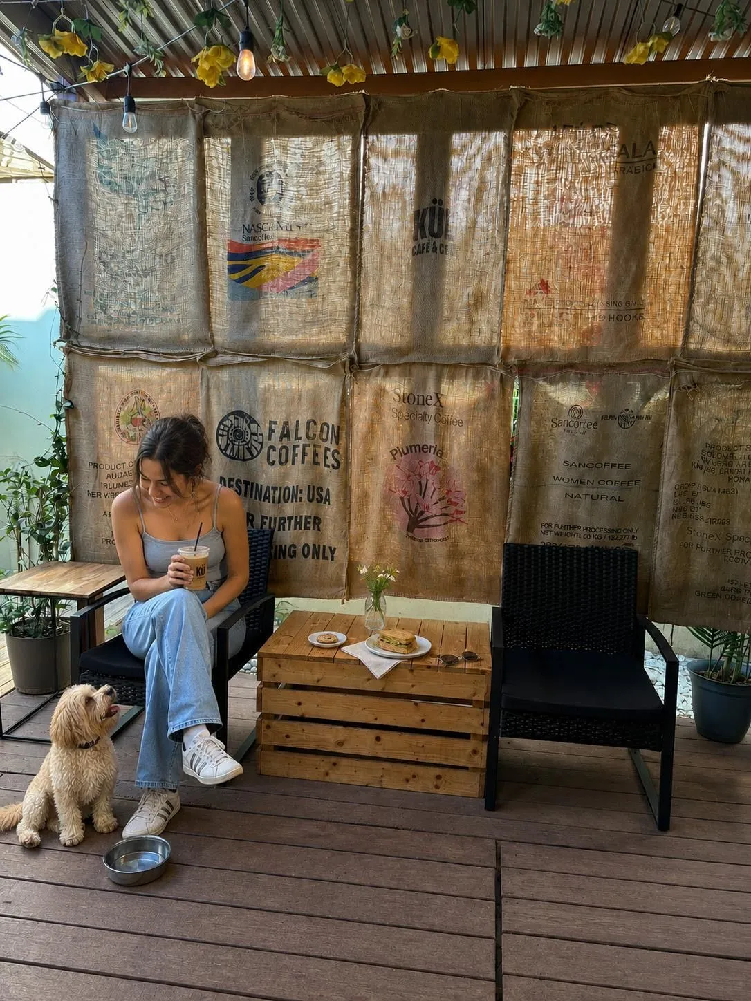 Savory sandwich and a sweet treat on a crate table in the Houston patio.